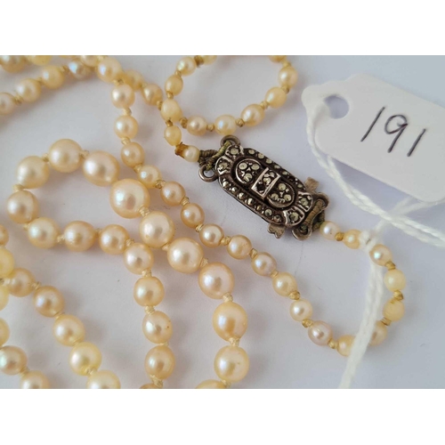 191 - A row of pearls with silver and marcasite clasp