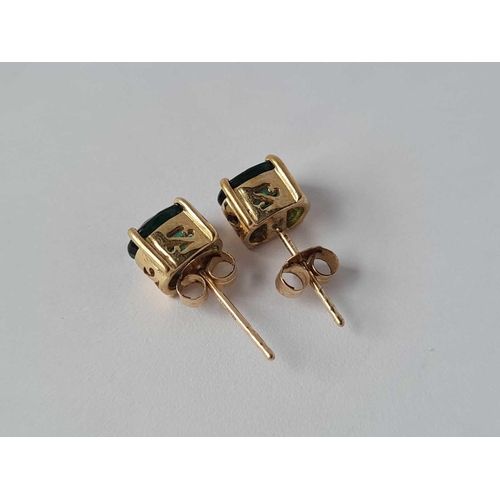 202 - A pair of 9ct green tourmaline ear studs