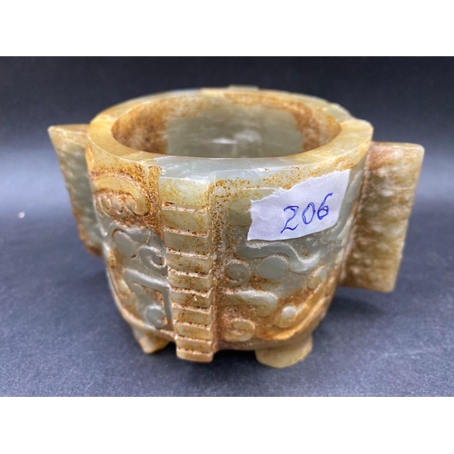 206 - A HAN JADE CONG BOWL ON FOUR FEET, 6cm high and 7cm diameter