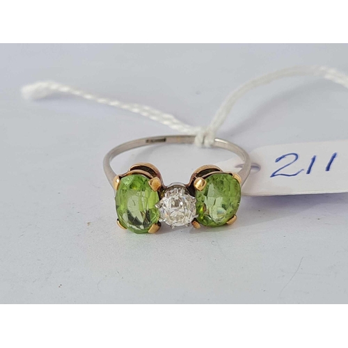 211 - A PLATINUM PERIDOT AND DIAMOND THREE STONE RING SIZE R      3.5 GMS