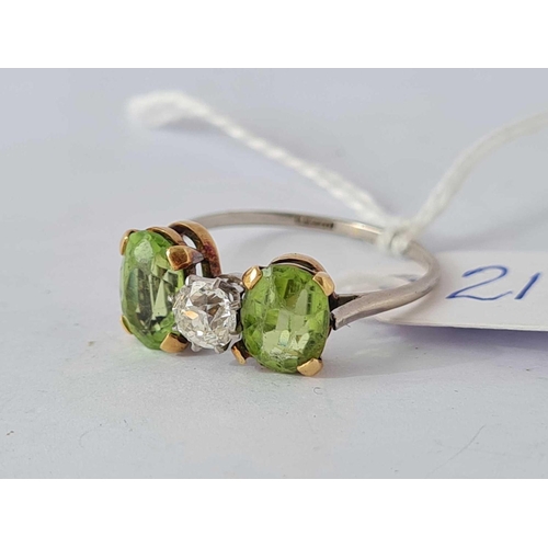 211 - A PLATINUM PERIDOT AND DIAMOND THREE STONE RING SIZE R      3.5 GMS