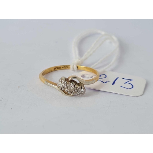 213 - A three stone cross over diamond ring 18ct gold size N