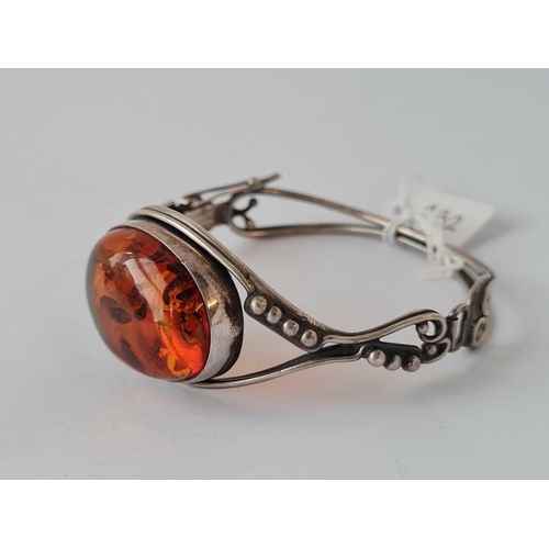 232 - A silver and amber bangle