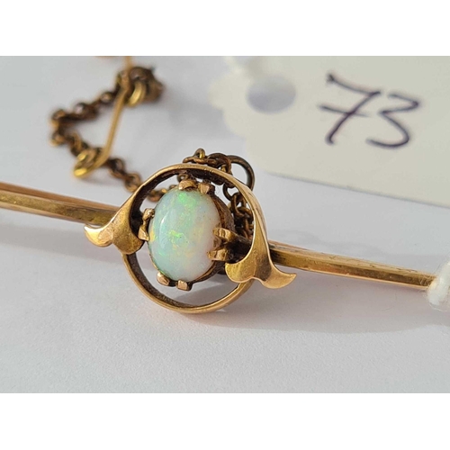 73 - An antique opal set 15ct gold bar brooch with safety chain 3.9g inc