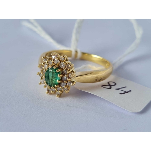 84 - A good emerald and diamond cluster ring 18ct gold