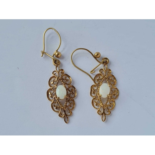 91 - A pair of decorative opal drop earrings