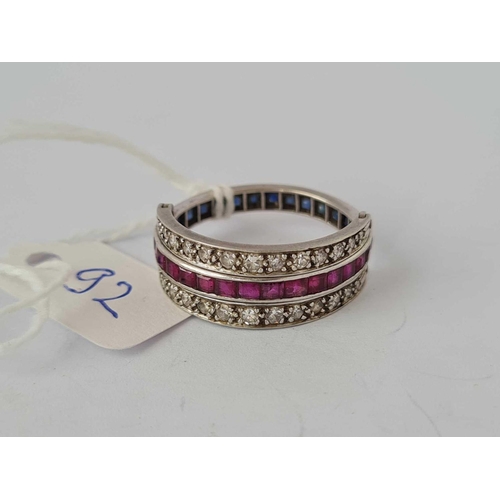 92 - A GOOD NIGHT & DAY RING SET WITH RUBIES, SAPPHIRE AND DIAMONDS, set in gold, size Q, 6.6 g.