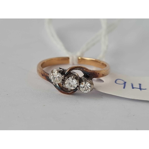 94 - A three stone diamond ring, 18ct, size J, 2.2 g.