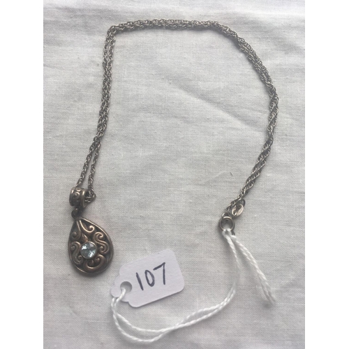 107 - A silver and blue topaz oval pendant necklace