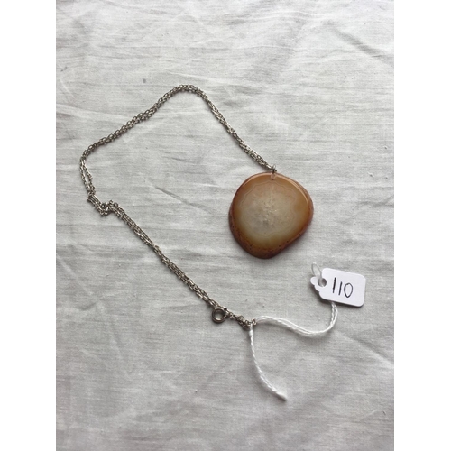 110 - A large agate pendant on silver chain