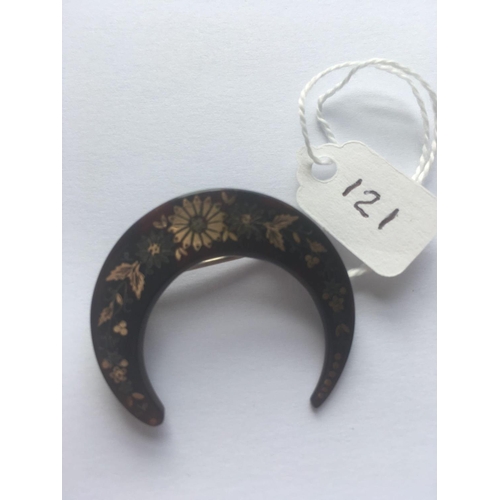 121 - A Victorian Tortoiseshell pique crescent brooch with gold and silver decoration