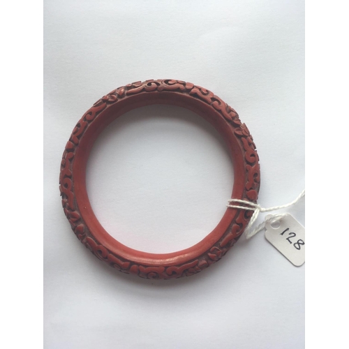 128 - A carved Cinnabar bangle