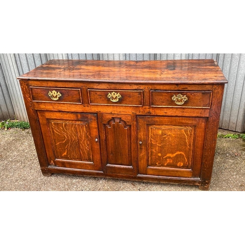 1656 - A George III oak dresser base with 3 drawers to freize and fielded panels and doors under, 4ft 6