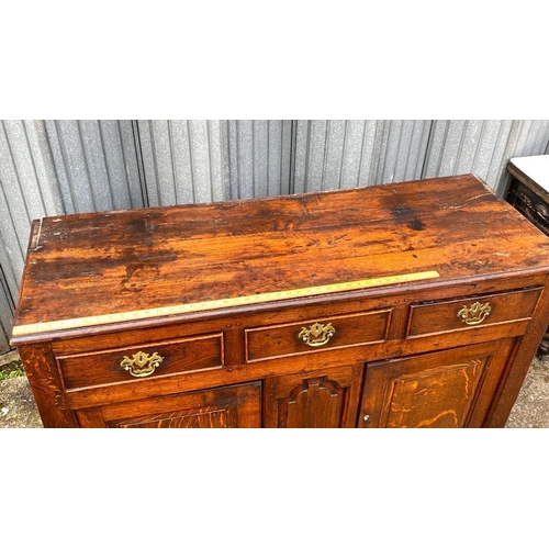 1656 - A George III oak dresser base with 3 drawers to freize and fielded panels and doors under, 4ft 6