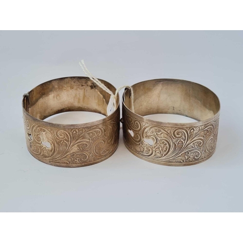 172 - A pair of silver buckle style bangles   57 gms