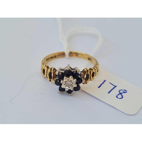 178 - A diamond and sapphire cluster ring 18ct gold size L   3.1 gms