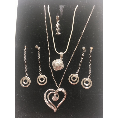 208 - Two silver and diamond pendants one silver tanzernite pendant and two pairs of silver and diamond dr... 