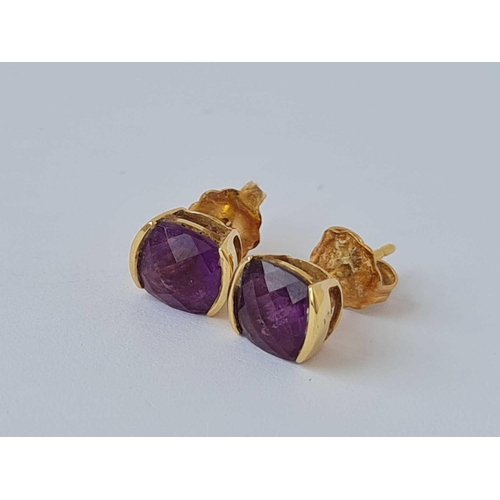 211 - A pair of amethyst earrings 18ct gold   1.6 gms