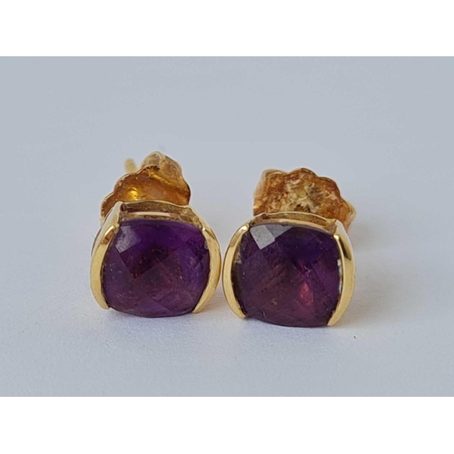 211 - A pair of amethyst earrings 18ct gold   1.6 gms