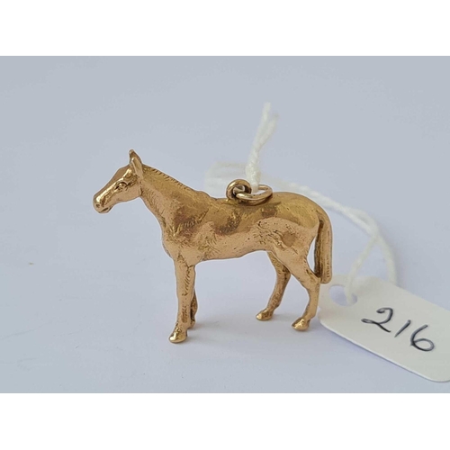 216 - A heavy cast gold horse pendant 9ct   10.1 gms