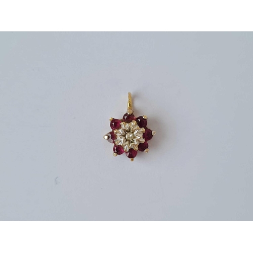 219 - A diamond and ruby cluster pendent 9ct