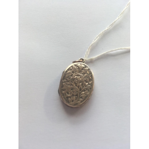 24 - A Victorian oval chased back and front locket