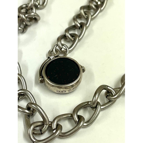 241 - A metal curb link watch chain with silver spinning fob