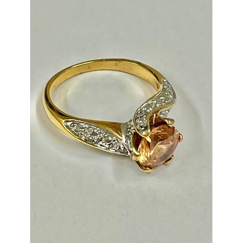 244 - A vintage diamond and orange stone ring