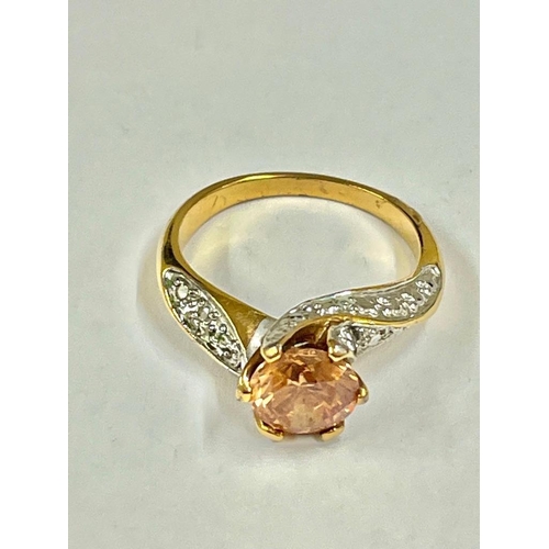 244 - A vintage diamond and orange stone ring