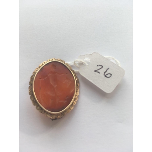 26 - A GEORGIAN GOLD BROOCH SET WITH A CARNELIAN CARVED INTAGLIO DEPICTING A GEORGIAN MAN IN A HUNTING SC... 