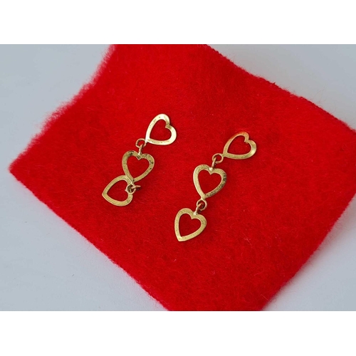 276 - A pair of drop earrings in the form of three hearts 9ct