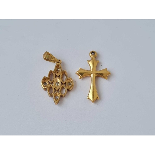 278 - A 14ct gold cross tested together with a 9ct white stone pendant