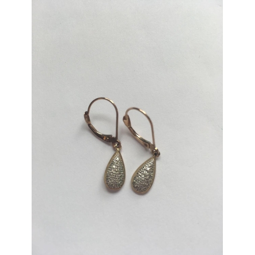 304 - A pair of diamond drop 10ct earrings 1.4g inc