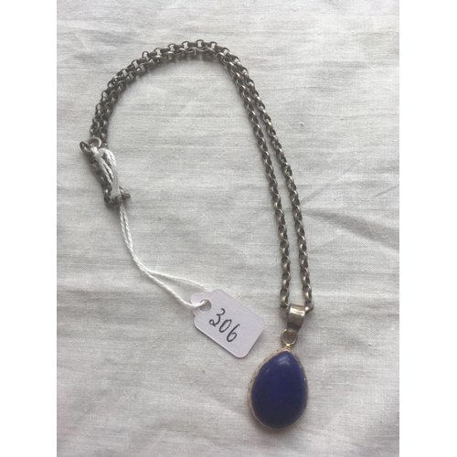 306 - A silver lapis lazuli pendant on metal chain