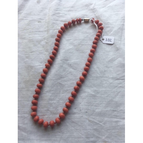 332 - A ANTIQUE STRING OF LARGE CORAL BEADS