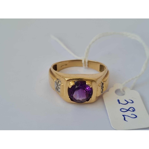 382 - A gold ring set with amethyst and diamond shoulders 14ct gold size X    5.3 gms