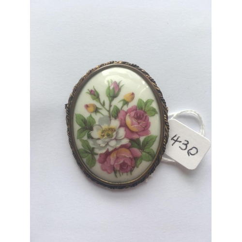 430 - A Limoges oval brooch depicting flowers