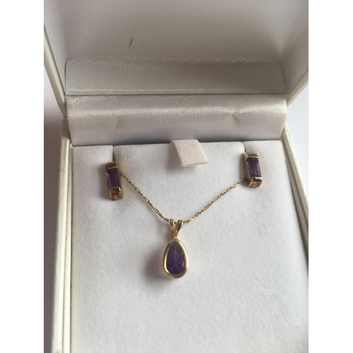 505 - A boxed amethyst and earring set in 9ct