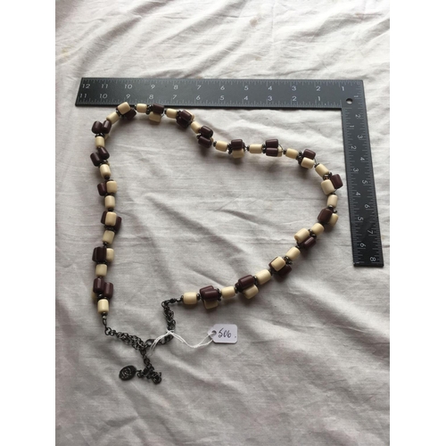 506 - A brown and white bead baker-light  necklace