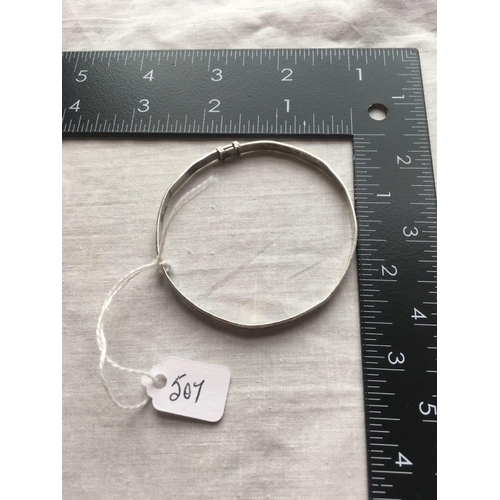 507 - A slim silver bangle with floral design BY CHARLES HORNER