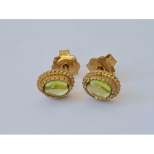 511 - A pair of peridot ear studs 9ct  2gms