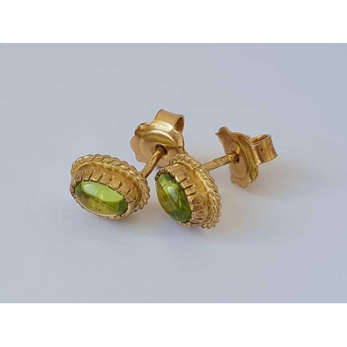 511 - A pair of peridot ear studs 9ct  2gms