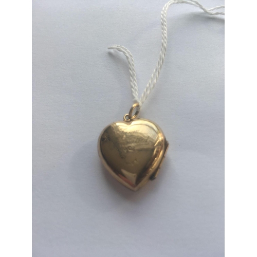 525 - A heart shaped back and front locket 9ct