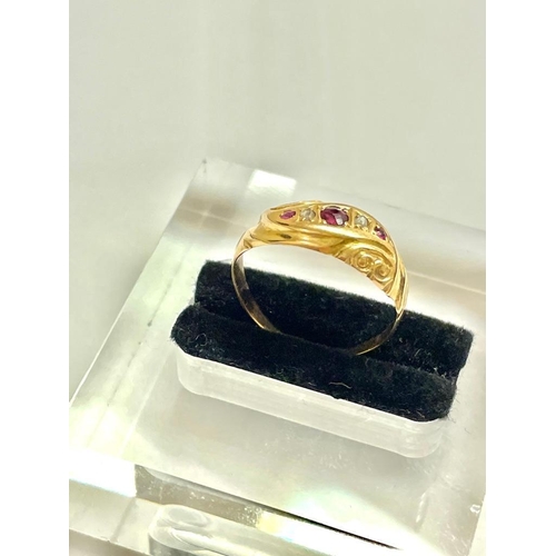 552 - A high carat gold diamond and ruby gypsy set five stone ring size J    1.4 gms