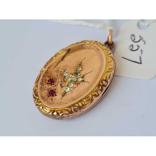 557 - A Victorian locket with paste set swallow design 9ct