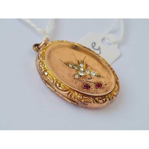 557 - A Victorian locket with paste set swallow design 9ct