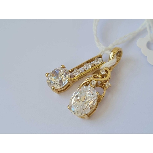 576 - Two white stone pendant 14ct gold   4.3 gms