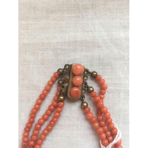 58 - A Victorian coral bead three strand necklace with original clasp