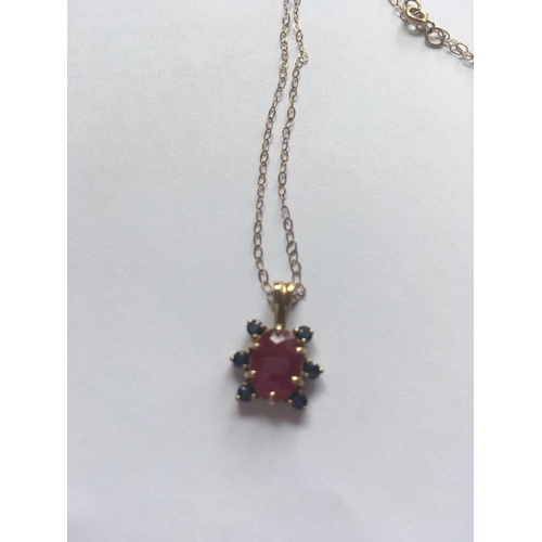 605 - A ruby & sapphire 9ct pendant on 9ct fine link chain