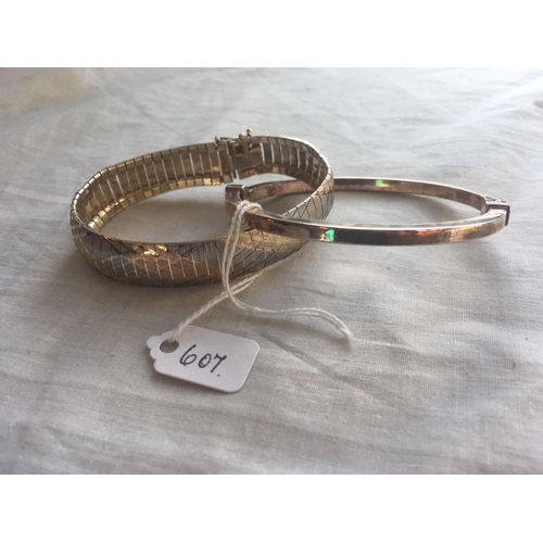 607 - A silver bangle and bracelet